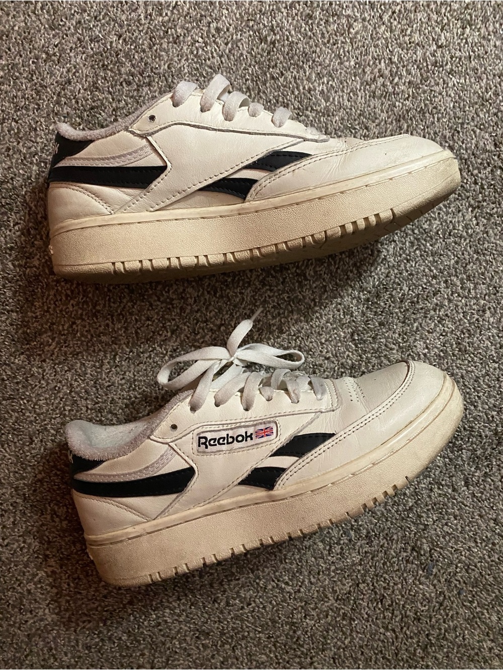 white reebok sneakers with black trim